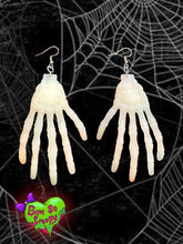 Glow in the dark skeleton hand earrings