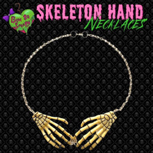 Beige skeleton hand necklace