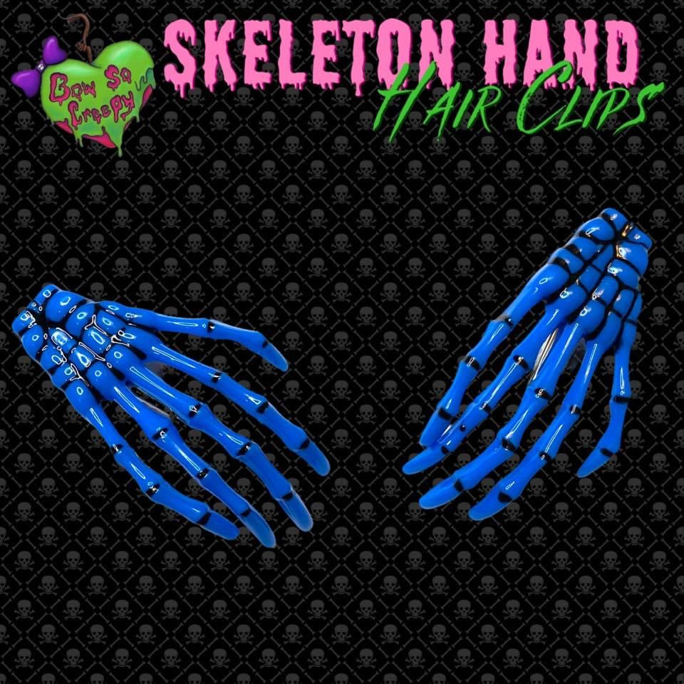 Blue skeleton hand hair clips