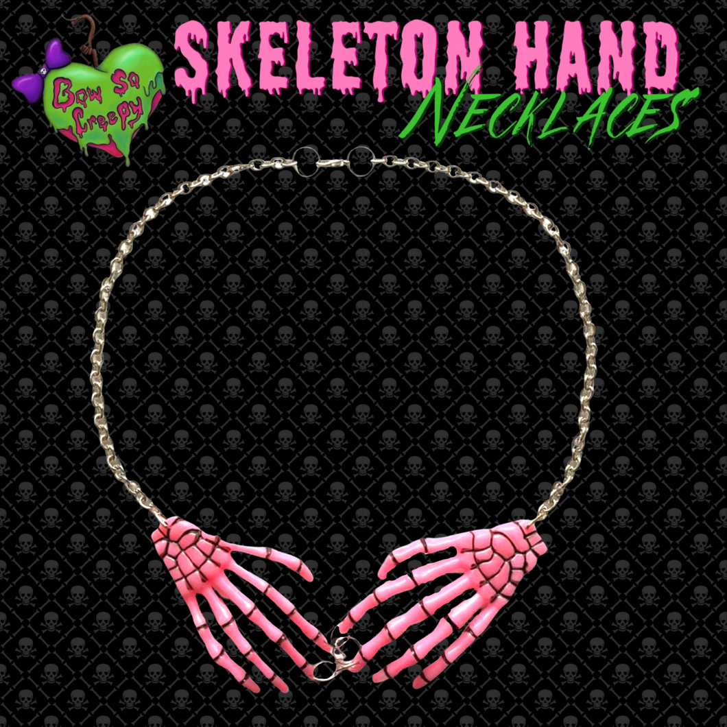 Light pink skeleton hand necklace