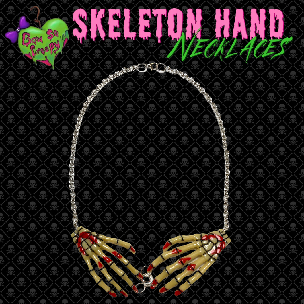 Bloody beige skeleton hand necklace