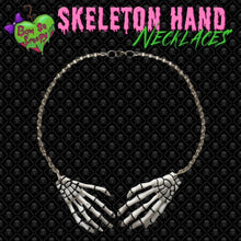 White skeleton hand necklace
